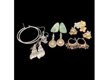 (7) Pairs Of Unique Earrings. Includes (1) Matching Charm