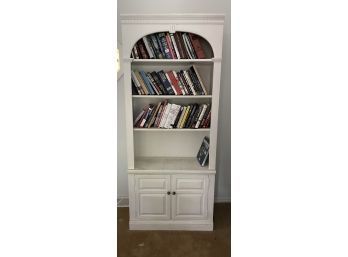 Adorable White Wooden Bookshelf With An Assortment Of Books