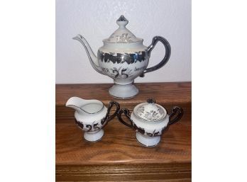 Lovely White And Silver Colored Tea Pot, Sugar Cup, And Creamer.