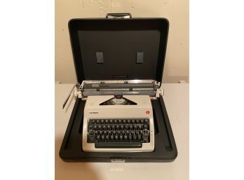 1970s Olympia SM Typewriting Machine With Soft Cover, Hard Case, And Cleaning Kit