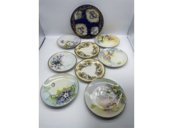 Collection Of Porcelain China Plates With Adorable Designs.