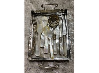 Small Footed Tray With Various Unique Flatware With Iridescent Accents