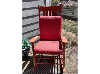 Orange Slat Rocking Chair With Red Cushions