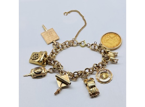 14 K Gold Bracelet, 8 Charms. Charms Appear To Be Gold. Not All Marked. 44.26 Grams