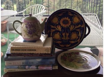 Collection Of Coffee Table Books, Teapot, And Decorative Plates