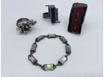 Assortment Of Beautiful Rings With Unique Designs, And Abalone Bracelet
