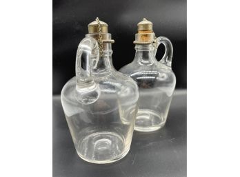 Two Decorative Antique Glass Bottles With Handles And Metal Caps And