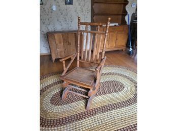 American Antique Rocking Chair With A Cane Seat