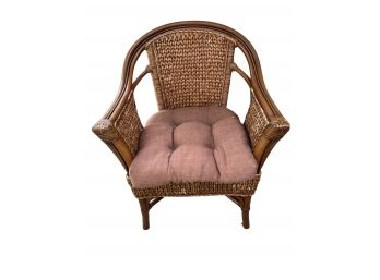 Outdoor Wicker Chair And Light Burgundy Toned Cushion