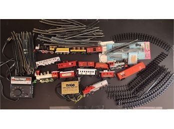 Assortment Of 4 Trains With Train Tracks