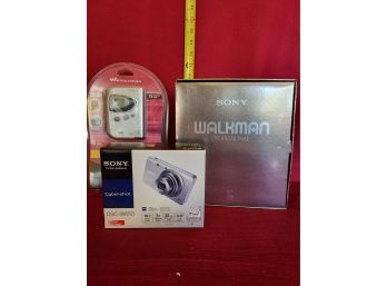 Two Sony Walkman And A Cyber Shot Camera