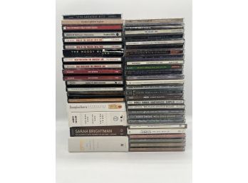 Assortment Of CDs Including Glen Campbell, Celine, Phil Collins And Pink Floyd (total Of 40)