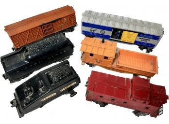 Box Of Toy Trains And A Few Trucks
