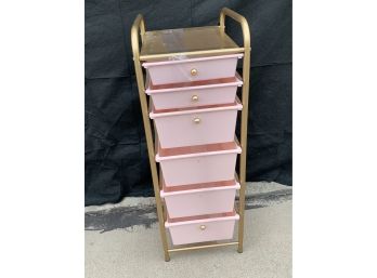 Multi-drawer Storage Rack With Golden Metal Frame And Pink Drawers And Decorative Knobs. Some Knobs Missing.