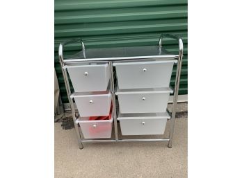 Storage Table With Plastic Pull Out Drawers And Metal Frame.