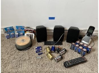 Lot Of Assorted Tech, Batteries, CDs, Three Samsung Speakers, Panasonic Landline, Remotes