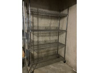Very Durable Metal Storage Shelf On Wheels! Four Shelfs With Racks On Back To Keep Items In Place.
