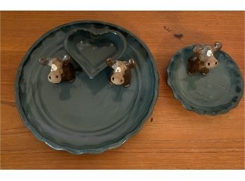 Set Of Geen Plates With Adorable Moose Figurines Attached.