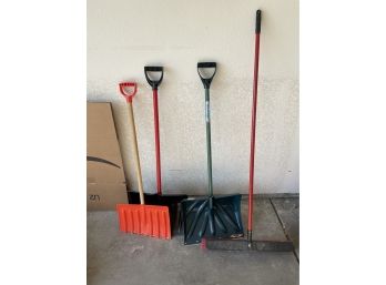 Lot Of Snow Shovels And Push Brooms