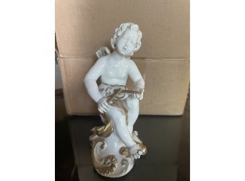 Porcelain Statue Of Child Playing The Violin With Gold Accents From Palais Oriental, Aruba.