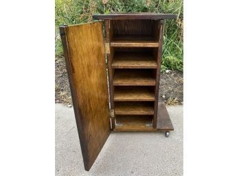 Small Wooden Cabinet On Wheels. Approximately 14x14x27 Inches.
