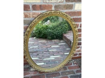 Beautiful Mirror Surrounded By A Gold Flower Accent Border.