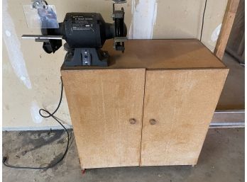 Black And Decker 6 Inch Bench Grinder Attached To A Wooden Storage Cabinet.