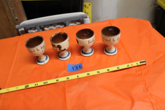 136   VINTAGE POTTERY SET 4 EGG CUPS ( SEE PICTURES EDGE DAMAGE ON ONE)
