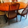 017 - DANISH TEAK DINING TABLE WITH TWO LEAVES AND SIX CHAIRS