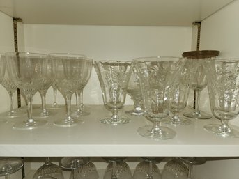 Shelf Full Of Glass Cups And Wine Cups