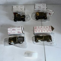 011 - FOUR VINTAGE METAL COIN BANK CAR MODELS