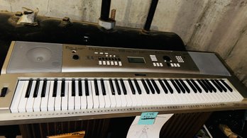 148 - KEYBOARD WITHN STAND - UNTESTED