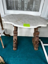 130 - HAND CARVED WOODEN TABLE WITH MARBLE TOP