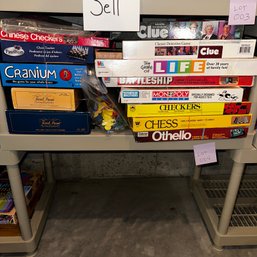 004 - LOT OF BOARD GAMES (SHELF NOT INCLUDED)