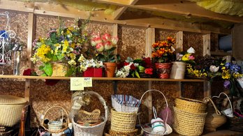 217 - 2 Shelves Of Basket And Faux Flowers