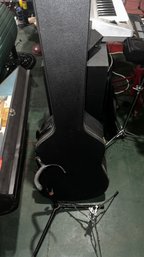 135 - CASE AND STAND FOR GUITAR