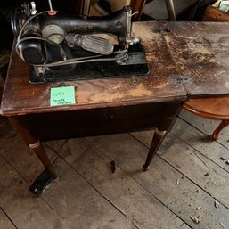 051 -OLD SEWING MACHINE IN A CABINET UNTESTED - (Attic)