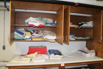 410 ~ SHELVES FULL OF LINENS, TABLE CLOTHES AND MORE