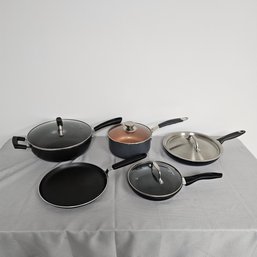 Several Pots And Pans With Griddle