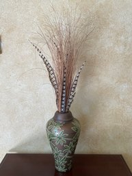 Tall Ceramic Vase From 3 Hands With Bronze Background, Green Foliage, & Pheasant Feather Arrangement B104