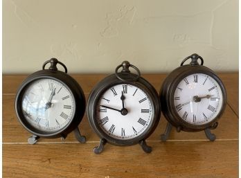 3 Clocks On Stands