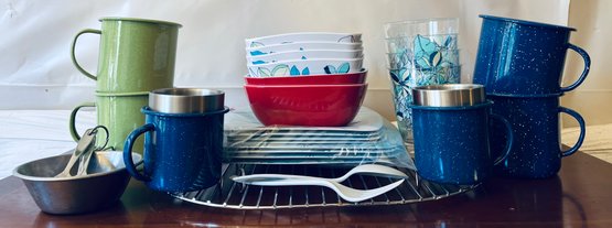 Assortment Of Camping Essentials Including Mugs, Plates And Utensils