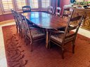 Hardwood Oval Dining Room Set With 8 Captain Chairs And Wool Area Rug