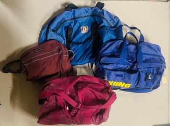 Assortment Of Duffel Bags, Travel Bags, And Ski Bags