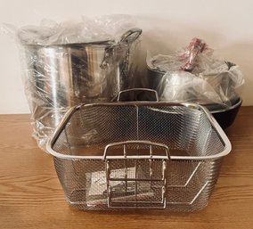 Assortment Of Stainless Steel Pots And Steam Racks