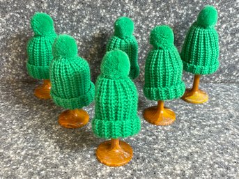 Small Wooden Egg Holders With Crochet Green Hat Covers