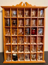 Collection Of Shot Glasses In Wall Case