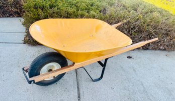 Yellow Wheel Barrow With Hose And Extension Cord