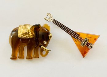 Two Amber Pins With One Sterling Silver