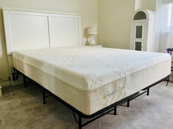 Minimalist White Headboard With Raised Metal Bed Frame And Queen Sized Health Care Mattress